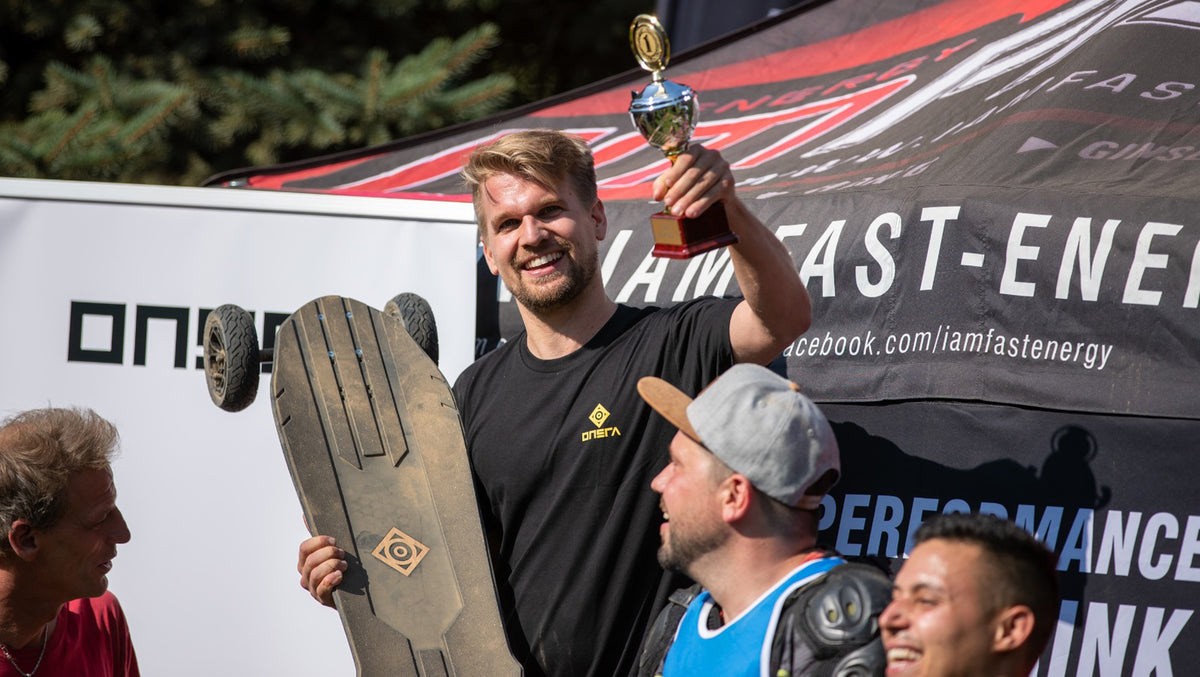 ONSRA team celebrating with a trophy and a Challenger at a race