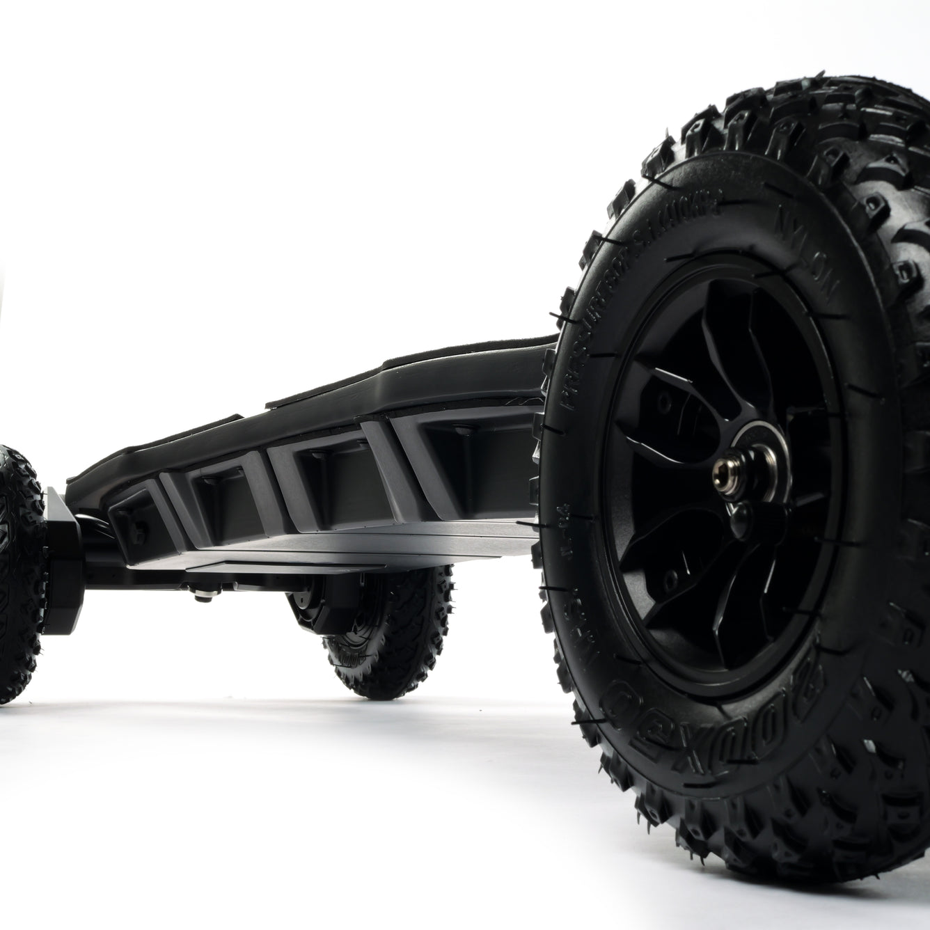 ONSRA BLACK Carve 4 premium electric longboard with a flexible bamboo deck, Gear Drive drivetrain, 14S battery, precision trucks, and all-terrain wheels, shown in a side profile.